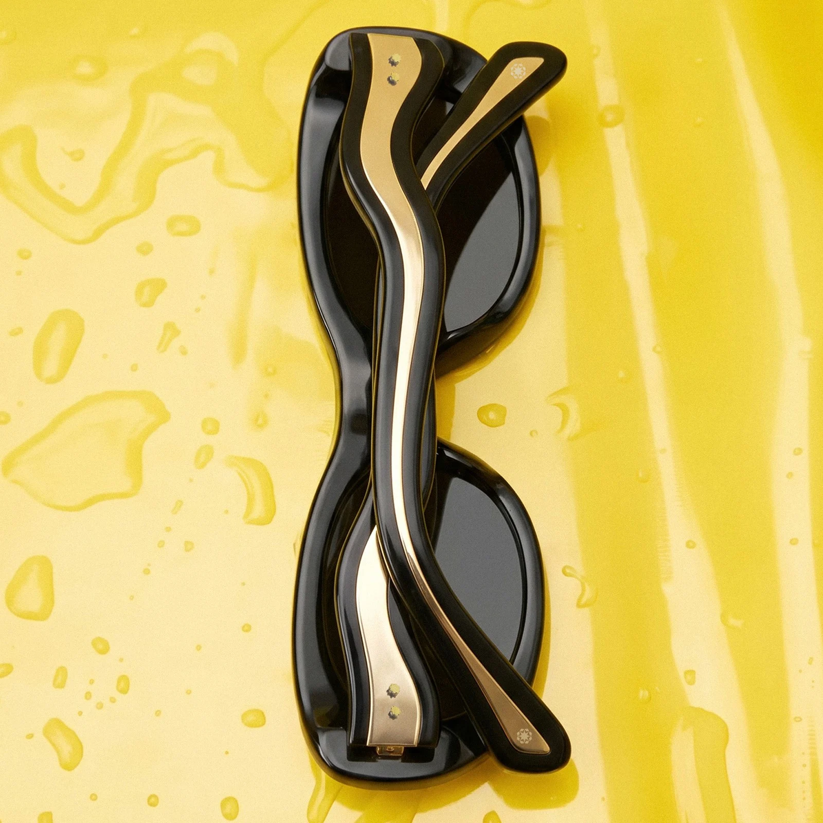 The sculptural wave-shaped temples of Flow against yellow